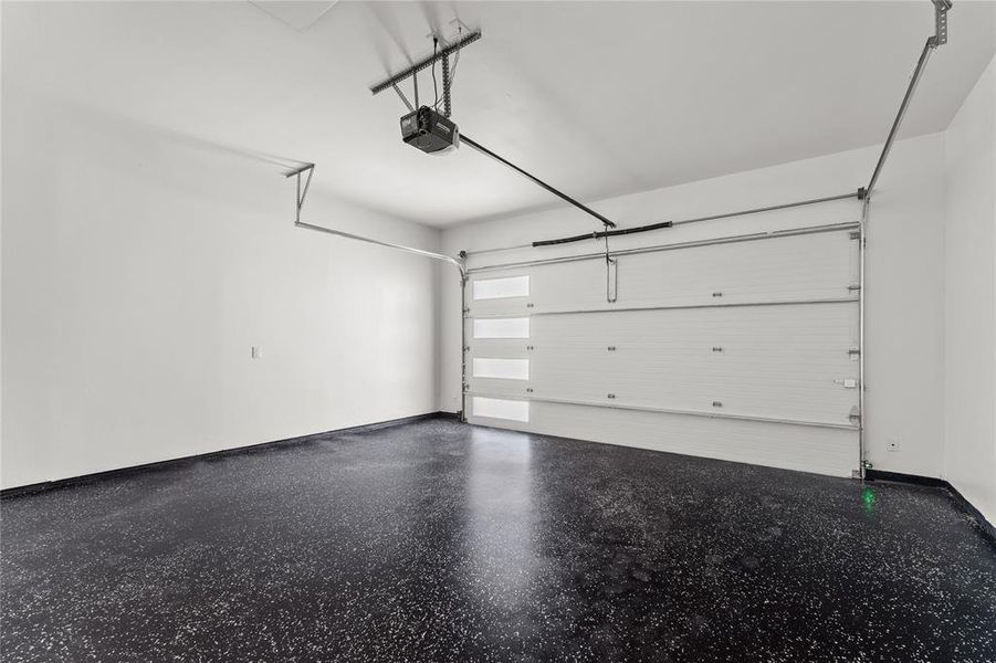 Garage featuring a garage door opener