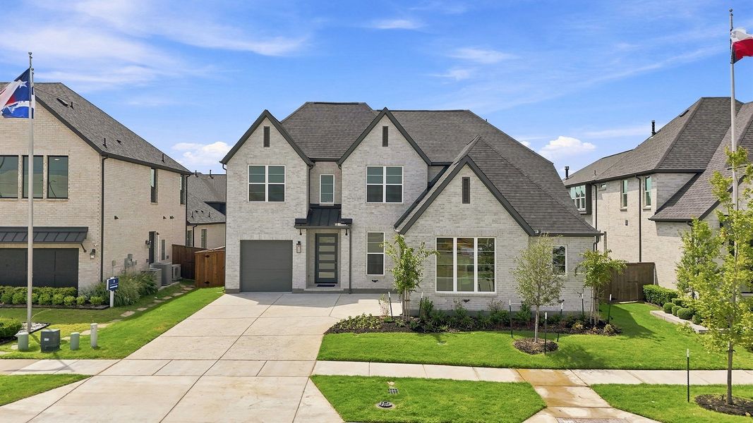 Front exterior of a new home in Estates at Rockhill, Frisco, TX, highlighting curb appeal (Image 22). Front exterior of a new home in Estates at Rockhill, Frisco, TX, highlighting curb appeal (Image 22).