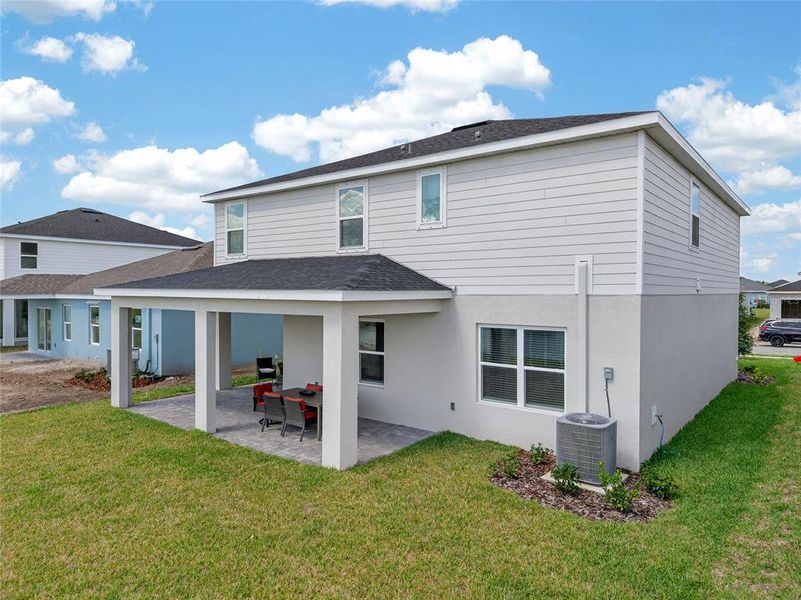 Exterior details and patio area of a home in West Port Single Family Homes, Port Charlotte (Image 25).