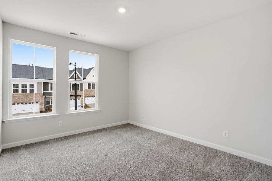 Spacious, unfurnished interior of a new home in Ovation at Sweetbrier, Durham (Image 28).