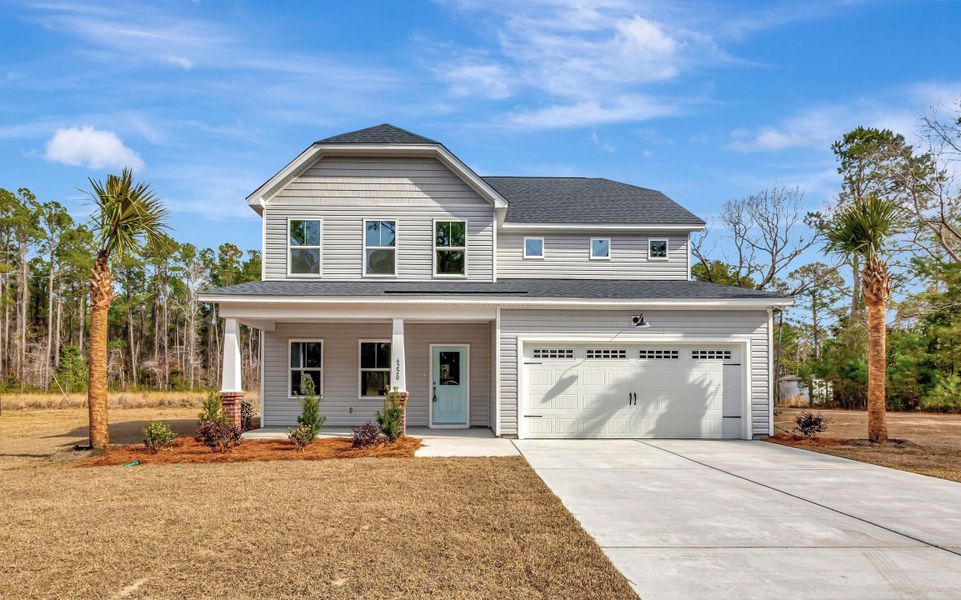 Front exterior of a new home in , Awendaw, SC, highlighting curb appeal (Image 2). Front exterior of a new home in , Awendaw, SC, highlighting curb appeal (Image 2).