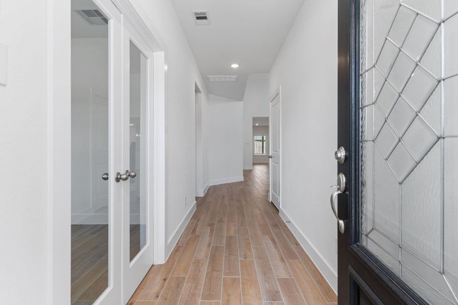 Welcome guests with a bright, airy foyer featuring clean lines, high ceilings, and easy-maintenance tile floors. This elegant entry sets the tone for the rest of this thoughtfully designed home. Welcome guests with a bright, airy foyer featuring clean lines, high ceilings, and easy-maintenance tile floors. This elegant entry sets the tone for the rest of this thoughtfully designed home.
