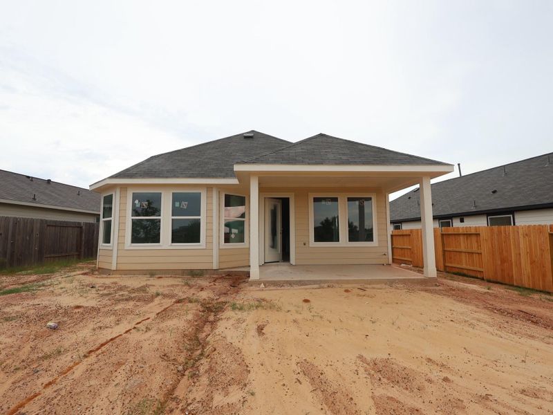 Front exterior of a new home in Magnolia Ridge, Magnolia, TX, highlighting curb appeal (Image 14).