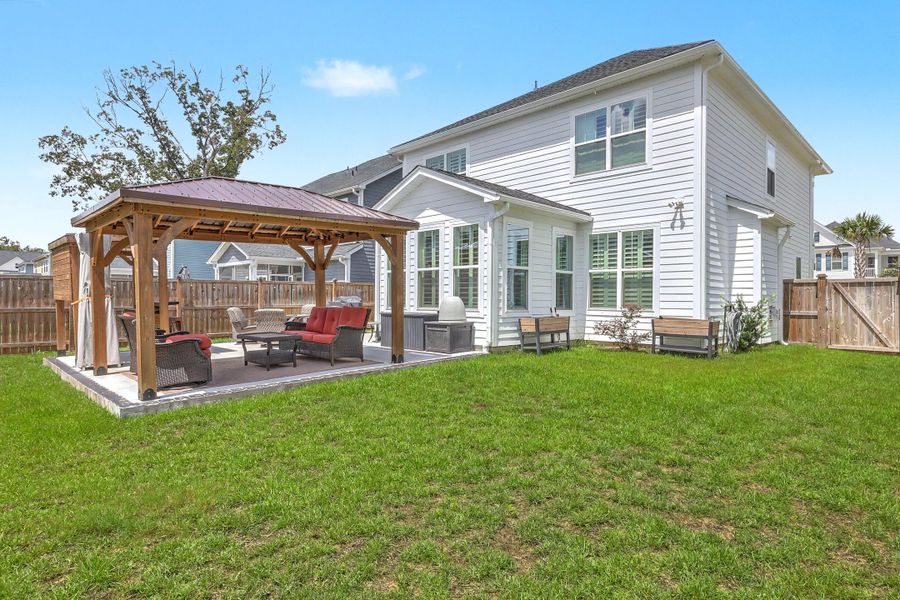 Exterior details and patio area of a home in , Johns Island (Image 28).