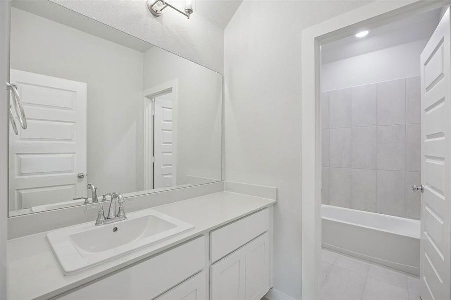 Bathroom in the Masters home plan by Trophy Signature Homes – REPRESENTATIVE PHOTO