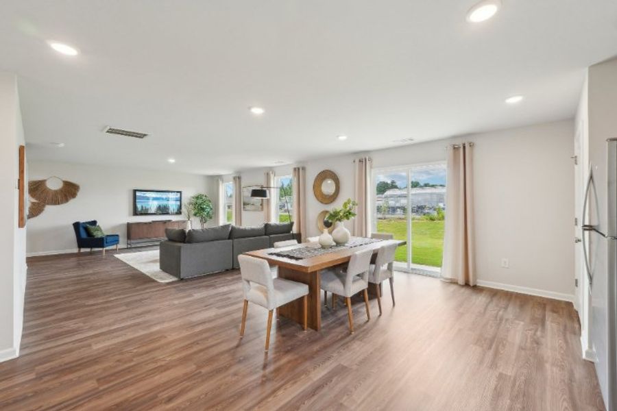 A large living room with a wood floor. A large living room with a wood floor.