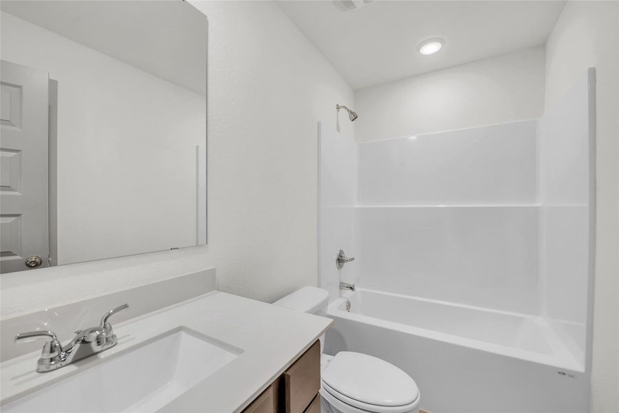 Bathroom with vanity and shower / bathtub combination