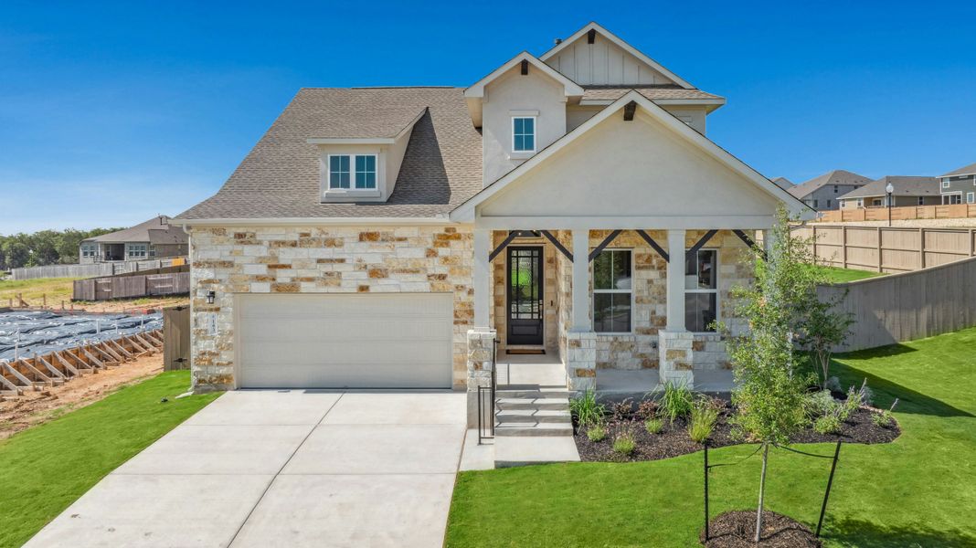 Front exterior of a new home in The Colony, Bastrop, TX, highlighting curb appeal (Image 2). Front exterior of a new home in The Colony, Bastrop, TX, highlighting curb appeal (Image 2).