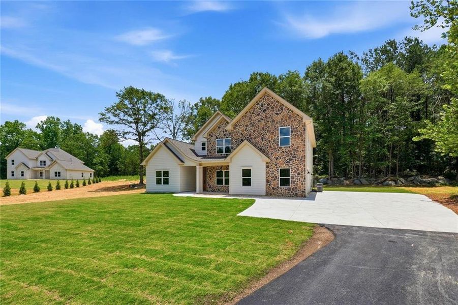 Front exterior of a new home in , Douglasville, GA, highlighting curb appeal (Image 2). Front exterior of a new home in , Douglasville, GA, highlighting curb appeal (Image 2).
