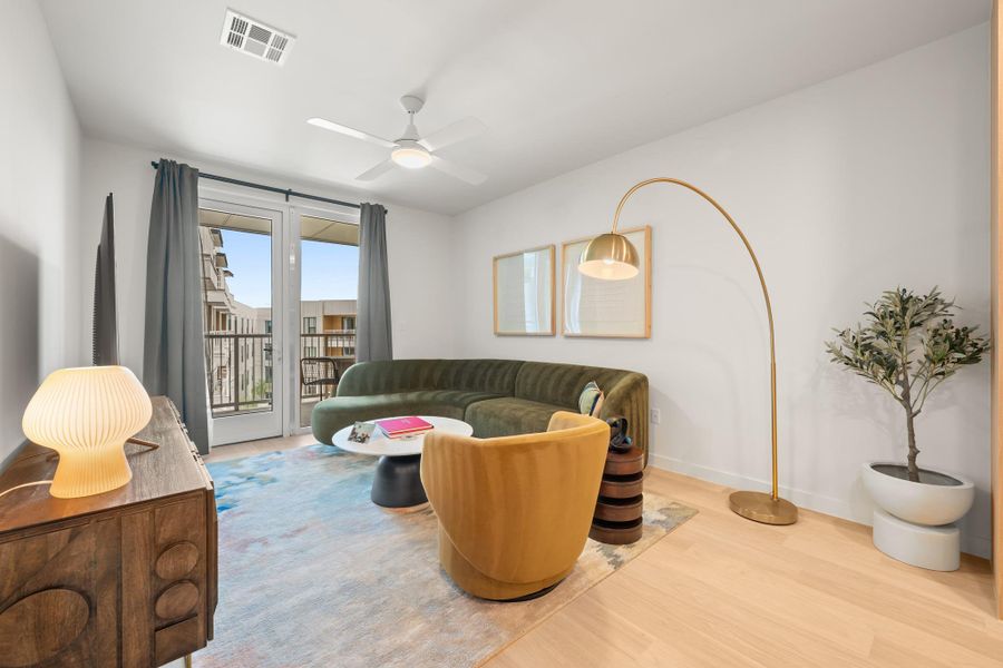 An open floor plan shown, fully furnished with Williams Sonoma selections featuring hotel level fabrics and curated accents throughout.