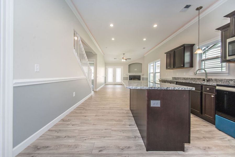 Representative furnished interior of a home built from the Quincy by Enchanted Homes in Lonesome Dove, San Antonio (Image 9).