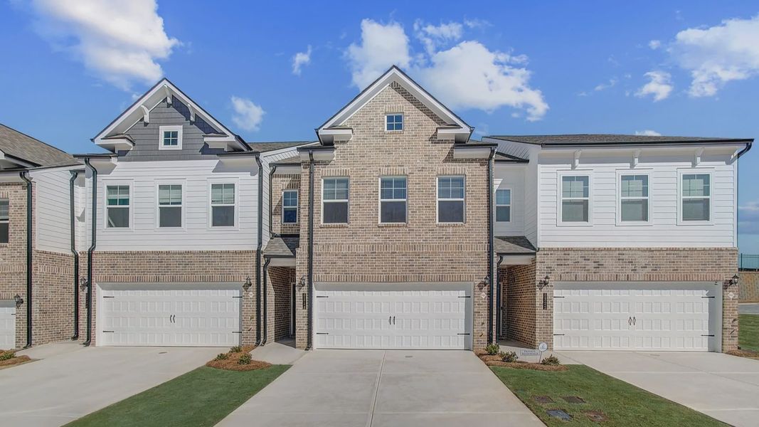 Front exterior of a new home in Auburn Ridge, Riverdale, GA, highlighting curb appeal (Image 1). Front exterior of a new home in Auburn Ridge, Riverdale, GA, highlighting curb appeal (Image 1).