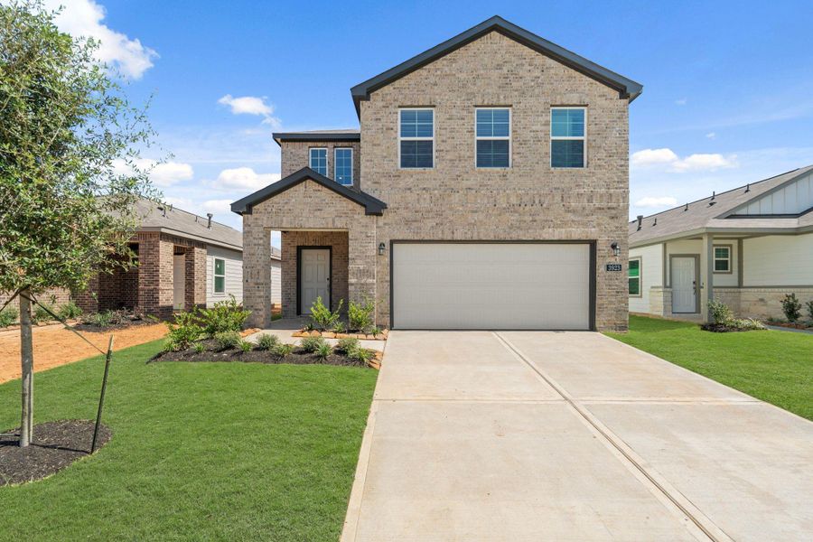 Front exterior of a new home in Laurel Farms, Brookshire, TX, highlighting curb appeal (Image 1). Front exterior of a new home in Laurel Farms, Brookshire, TX, highlighting curb appeal (Image 1).