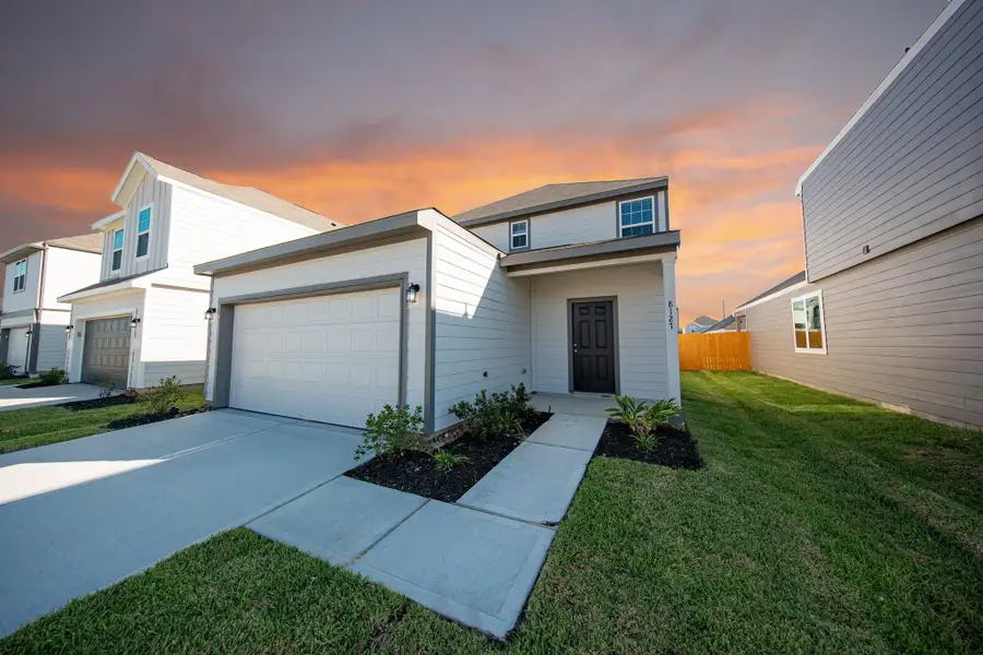 Front exterior of a new home in Wayside Village, Houston, TX, highlighting curb appeal (Image 2). Front exterior of a new home in Wayside Village, Houston, TX, highlighting curb appeal (Image 2).
