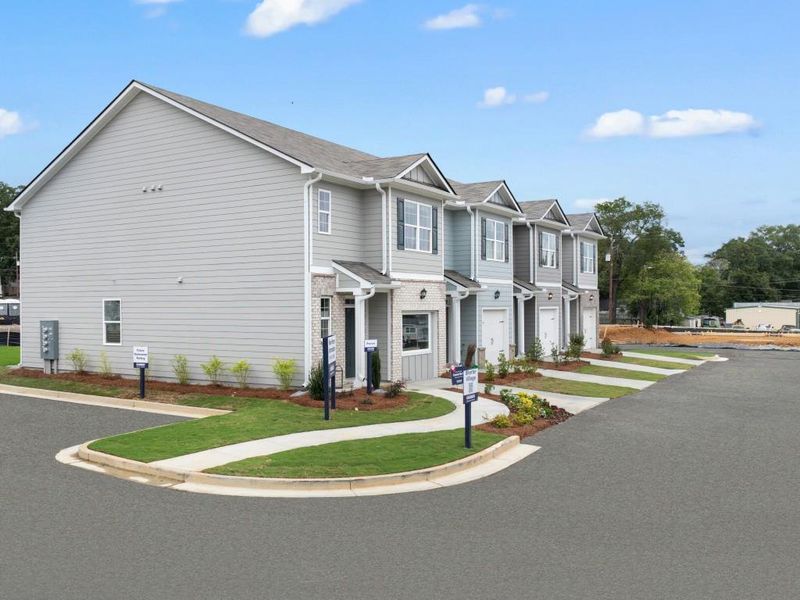 Front exterior of a new home in Woodbury Park, Atlanta, GA, highlighting curb appeal (Image 1). Front exterior of a new home in Woodbury Park, Atlanta, GA, highlighting curb appeal (Image 1).