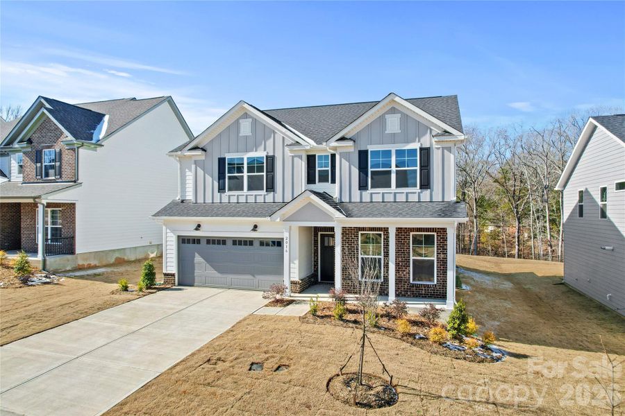 Front exterior of a new home in Forest Creek, Waxhaw, NC, highlighting curb appeal (Image 22).