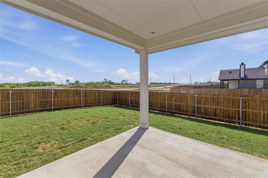 Fenced backyard featuring a patio area