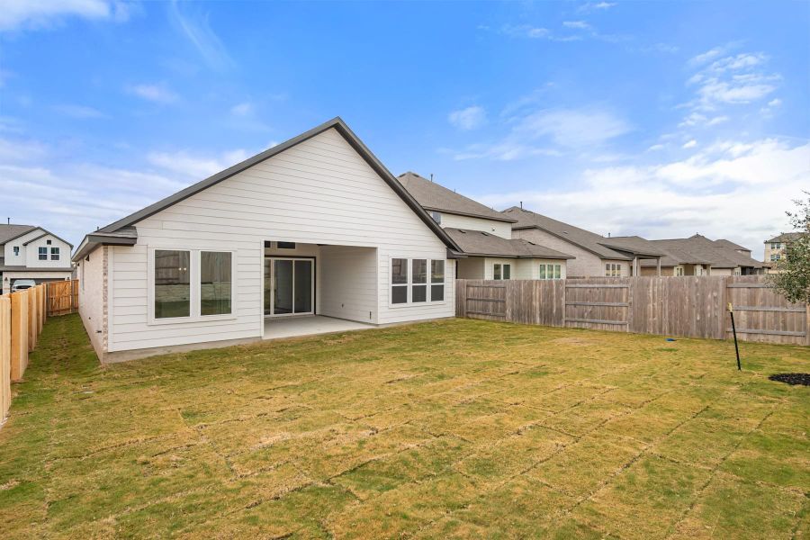 Exterior details and patio area of a home in Lariat, Liberty Hill (Image 26).