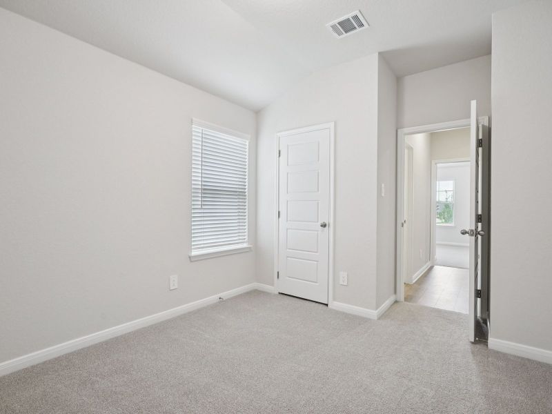 Guest bedroom in the Briscoe floorplan at a Meritage Homes community. Guest bedroom in the Briscoe floorplan at a Meritage Homes community.
