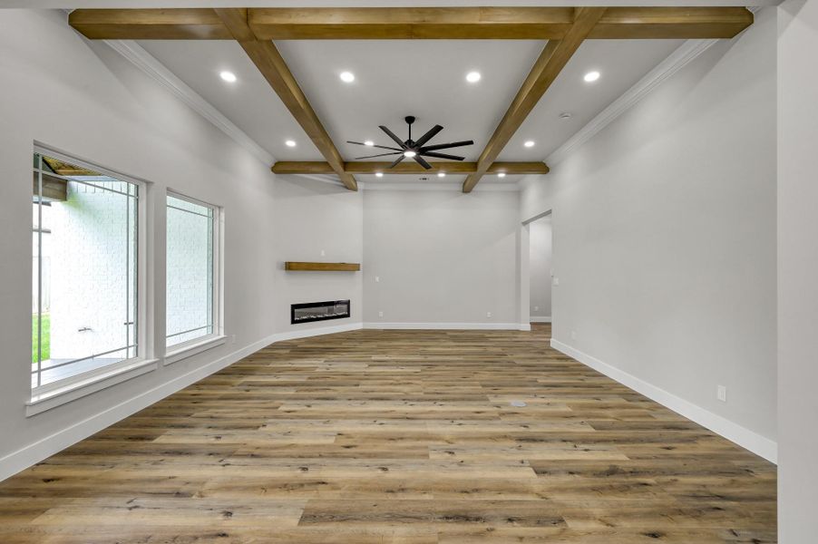 Walls of windows fill the living room with soft natural light and provide a serene view of the backyard. Walls of windows fill the living room with soft natural light and provide a serene view of the backyard.