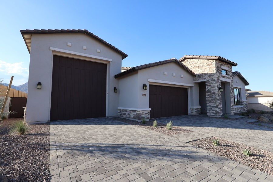 Front exterior of a new home in Alta at Verrado Regent Hills, Buckeye, AZ, highlighting curb appeal (Image 2). Front exterior of a new home in Alta at Verrado Regent Hills, Buckeye, AZ, highlighting curb appeal (Image 2).