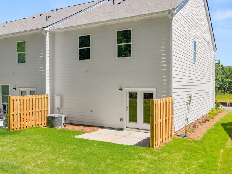 Exterior details and patio area of a home in Falcon Landing Townhomes, Gainesville (Image 19).