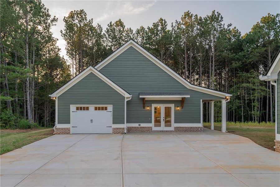 Front exterior of a new home in , Social Circle, GA, highlighting curb appeal (Image 1).