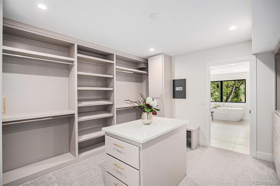Custom built-out primary closet with island