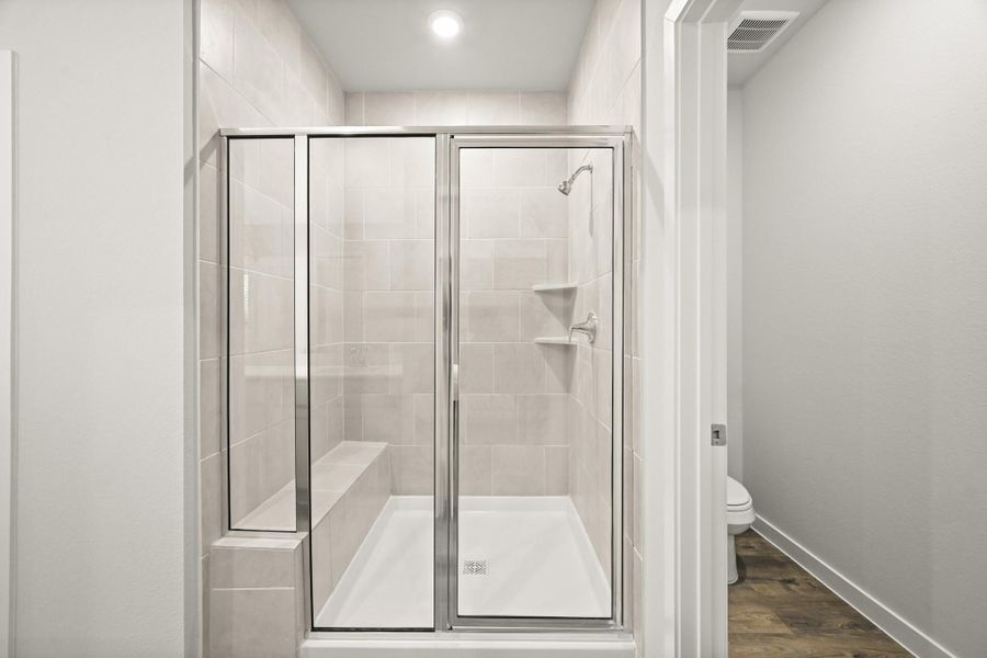 Furnished interior view inside a new home in Sunterra, Katy (Image 11).