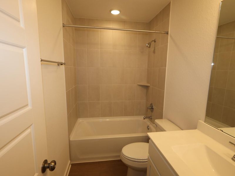 Furnished interior view inside a new home in Pinewood at Grand Texas, New Caney (Image 1).