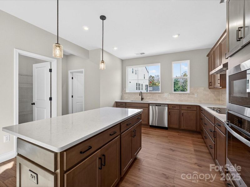 Large Central Island Ideal for Casual Dining or Entertaining.