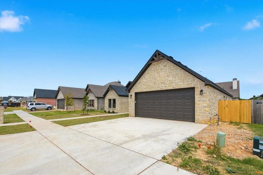 Front exterior of a new home in , Woodway, TX, highlighting curb appeal (Image 2). Front exterior of a new home in , Woodway, TX, highlighting curb appeal (Image 2).