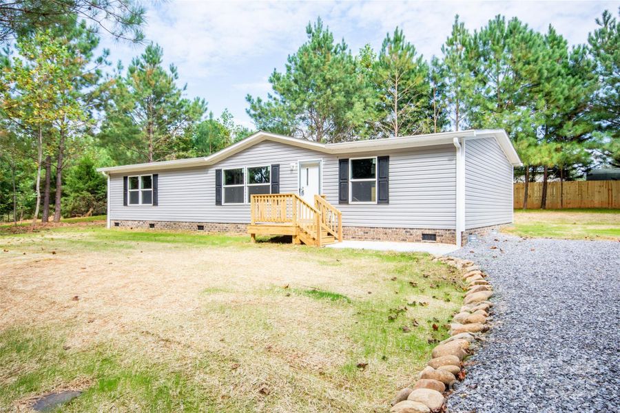 Front exterior of a new home in , Statesville, NC, highlighting curb appeal (Image 13).
