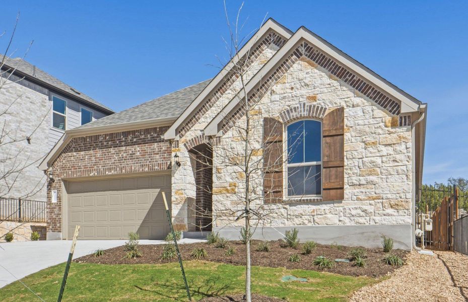 Front exterior of a new home in West Cypress Hills, Spicewood, TX, highlighting curb appeal (Image 18).