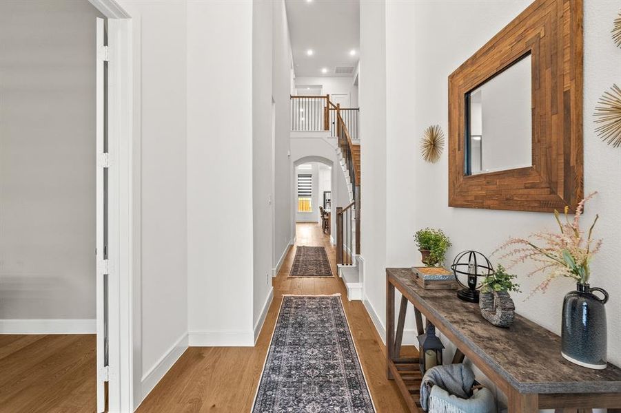 Hall with light engineered wood-style floors