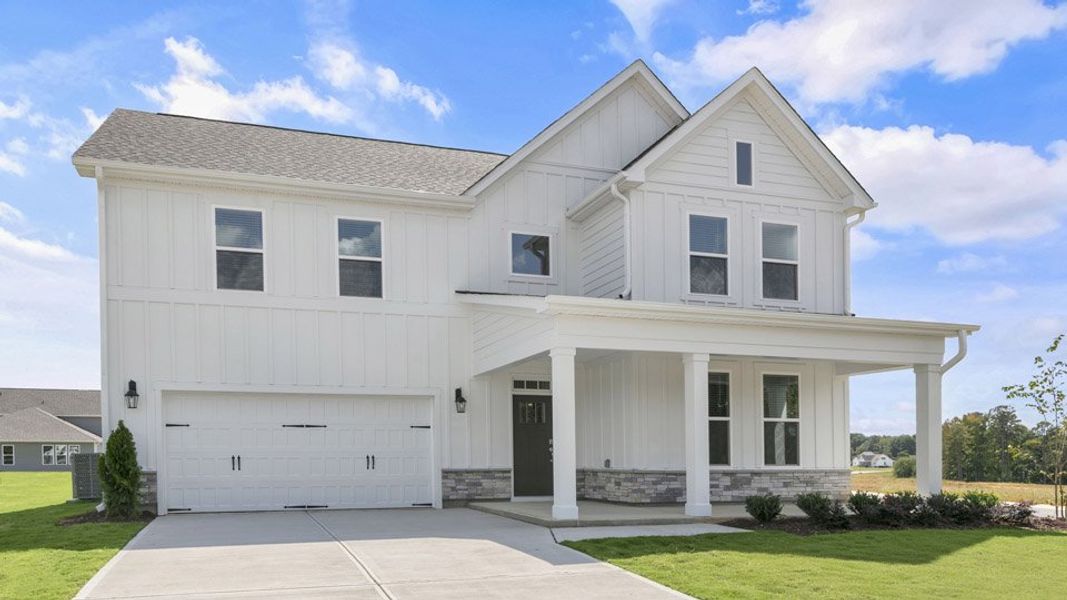 Representative exterior photo of a completed home built from the HARTWELL by D.R. Horton in Eagle Creek, Fuquay Varina, NC (Image 25).
