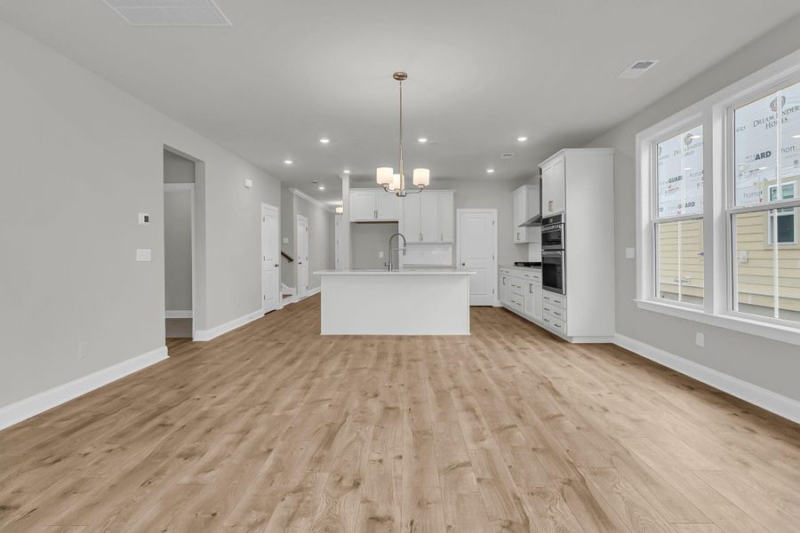 Spacious, unfurnished interior of a new home in Tidewater at Lakes of Cane Bay, Summerville (Image 21).