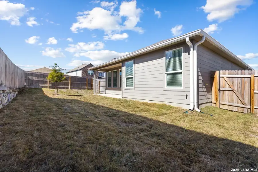 Exterior details and patio area of a home in Hightop Ridge, Converse (Image 33).