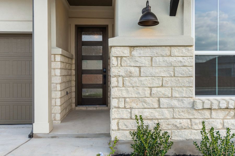 Exterior details and patio area of a home in Lariat, Liberty Hill (Image 4).