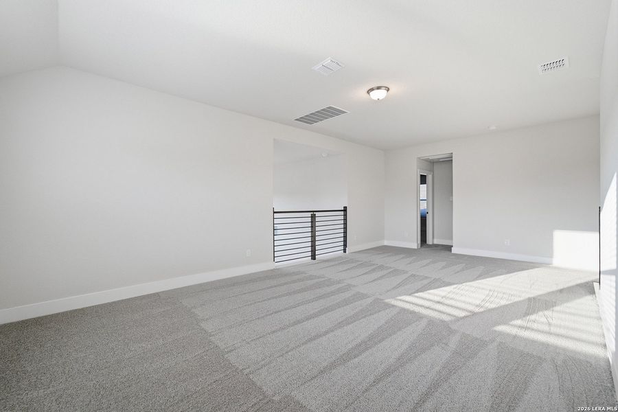 Spacious, unfurnished interior of a new home in The Woodlands at Medina Hills, Mico (Image 26).