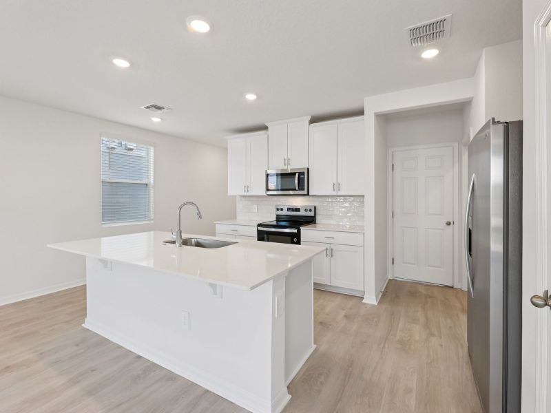 Furnished interior view inside a new home in The Meadow at Crossprairie Townes, St. Cloud (Image 3).