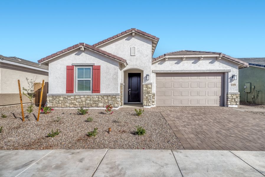 Front exterior of a new home in Madera, Queen Creek, AZ, highlighting curb appeal (Image 1). Front exterior of a new home in Madera, Queen Creek, AZ, highlighting curb appeal (Image 1).