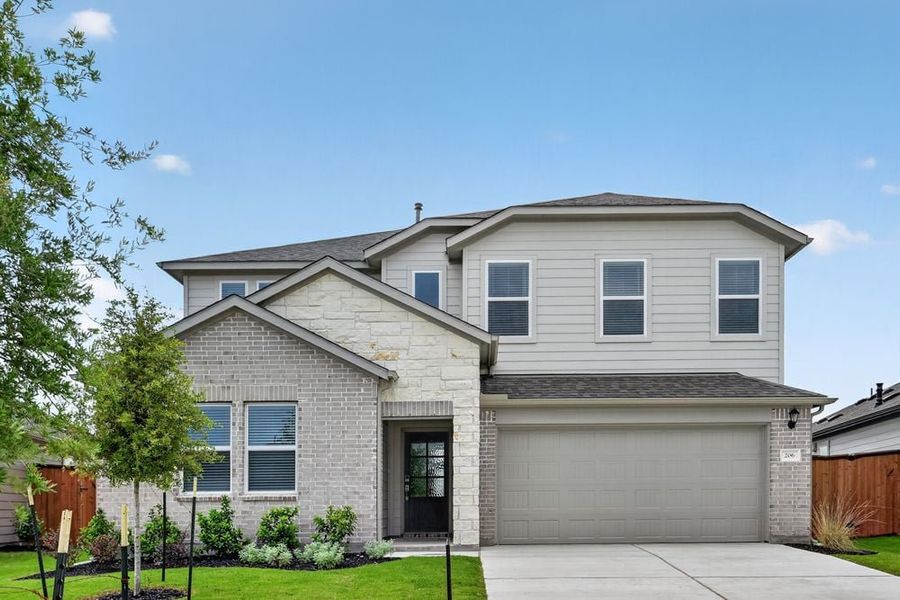 Representative exterior photo of a completed home built from the Warbler by Taylor Morrison in Emory Crossing, Hutto, TX (Image 13).