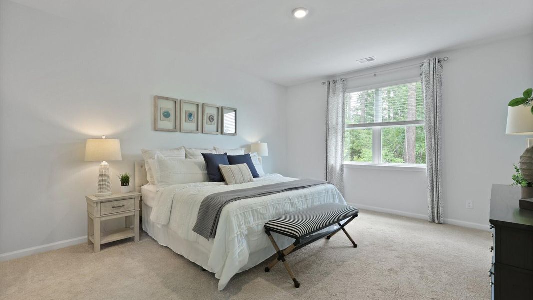 Furnished interior view inside a new home in Pine Hills at Cane Bay, Summerville (Image 9). Furnished interior view inside a new home in Pine Hills at Cane Bay, Summerville (Image 9).