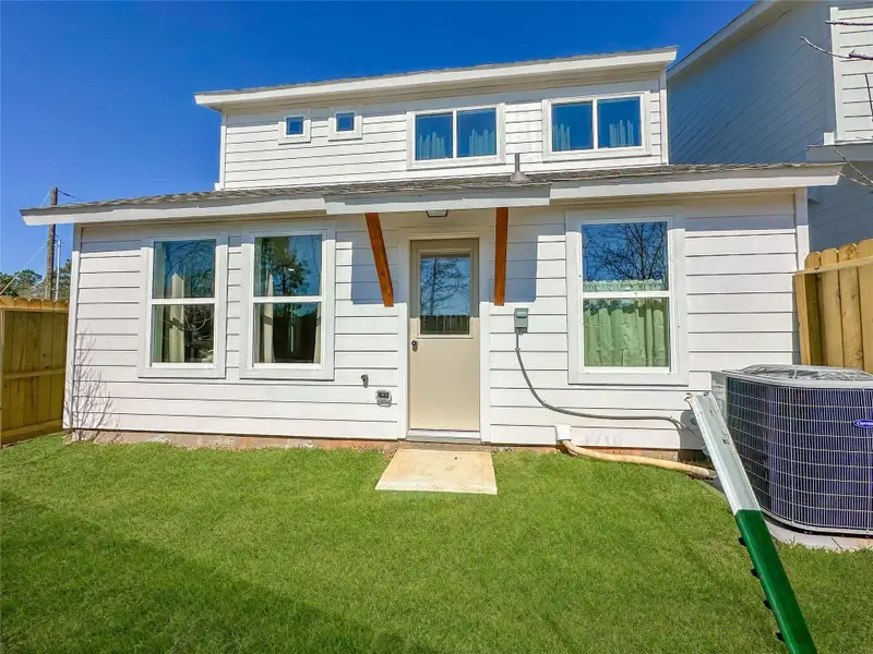 Exterior details and patio area of a home in , Conroe (Image 4).