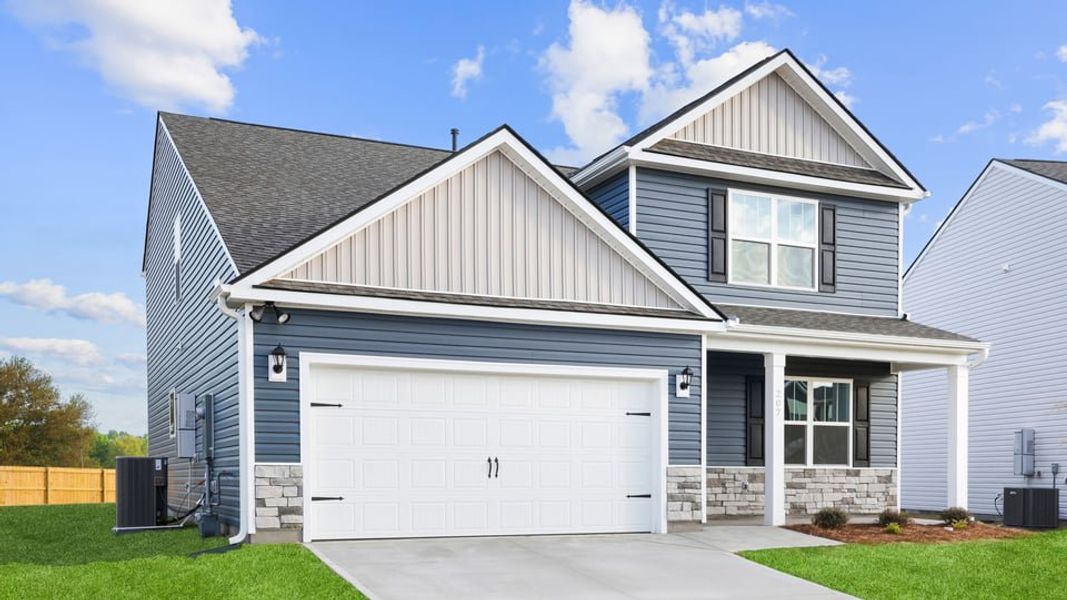 Front exterior of a new home in Sherwood Gardens, Landrum, SC, highlighting curb appeal (Image 2). Front exterior of a new home in Sherwood Gardens, Landrum, SC, highlighting curb appeal (Image 2).