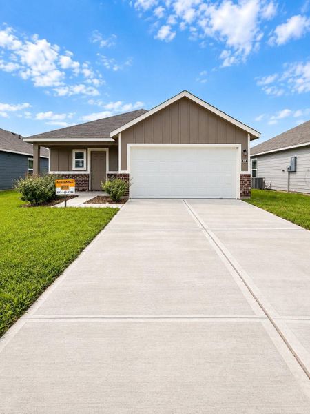 Front exterior of a new home in , Dayton, TX, highlighting curb appeal (Image 2). Front exterior of a new home in , Dayton, TX, highlighting curb appeal (Image 2).