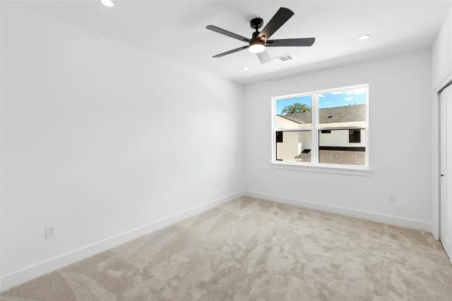 Spare room with light carpet, a ceiling fan, and recessed lighting
