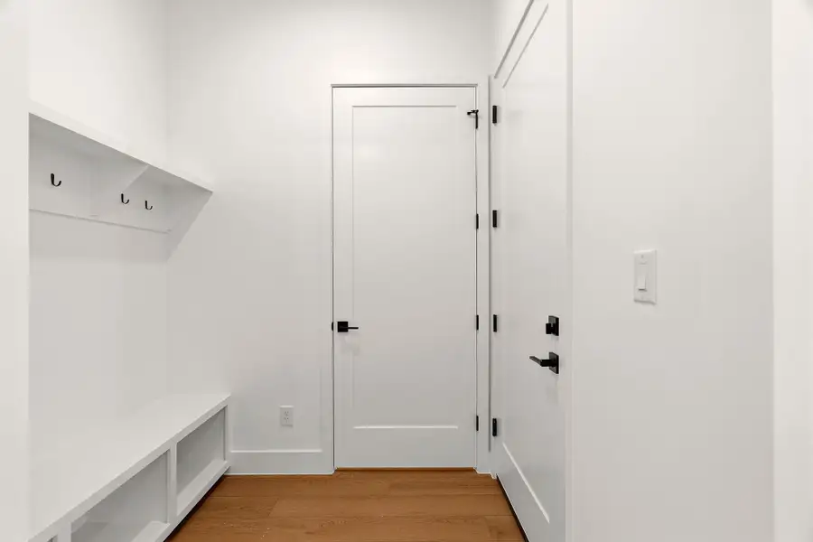 Mudroom featuring light wood finished floors