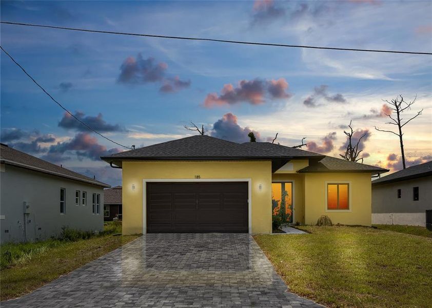 Front exterior of a new home in , Rotonda West, FL, highlighting curb appeal (Image 21).